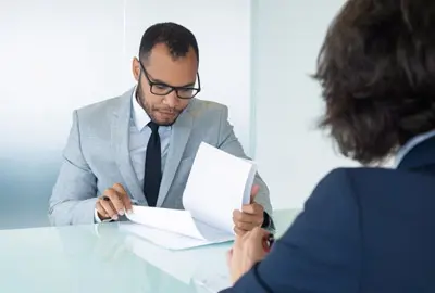 Attorney and client discussing documents needed for consular processing