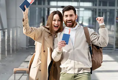 Couple leaving immigration office after getting Green Card