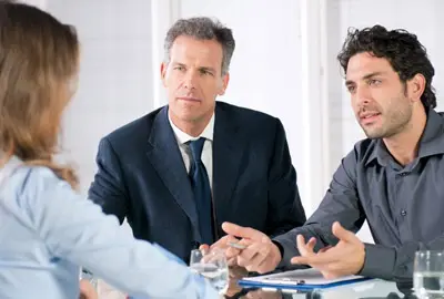 A married couple discussing options to deal with a deportation order