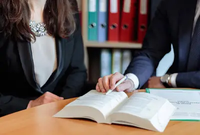 Lawyer explaining how to avoid detention if immigration authorities arrive at his client's home in the United States Lawyer explaining how to avoid detention if immigration authorities arrive at his client's home in the United States