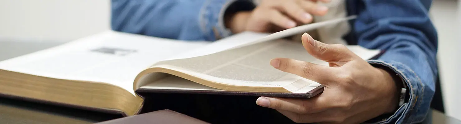Legal counsel reading about the requirements and benefits of deferred action