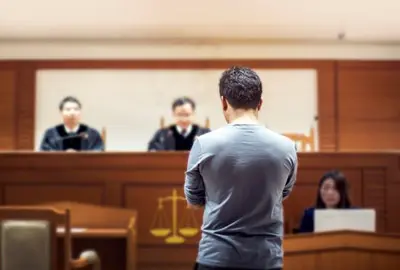 Man being tried for felony and possibly deported