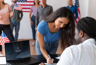 Person reviewing information on affirmative and defensive asylum types