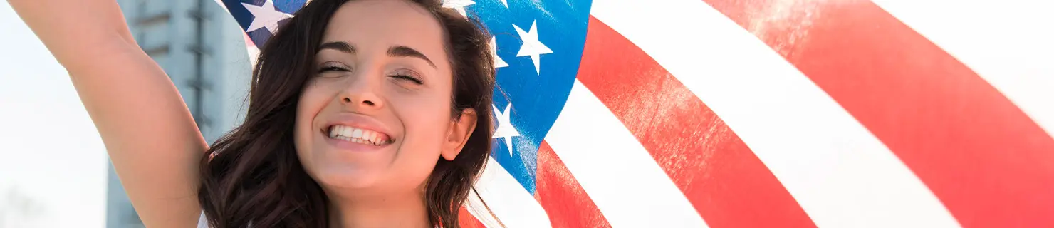 Happy woman after obtaining American citizenship and naturalization in Dallas
