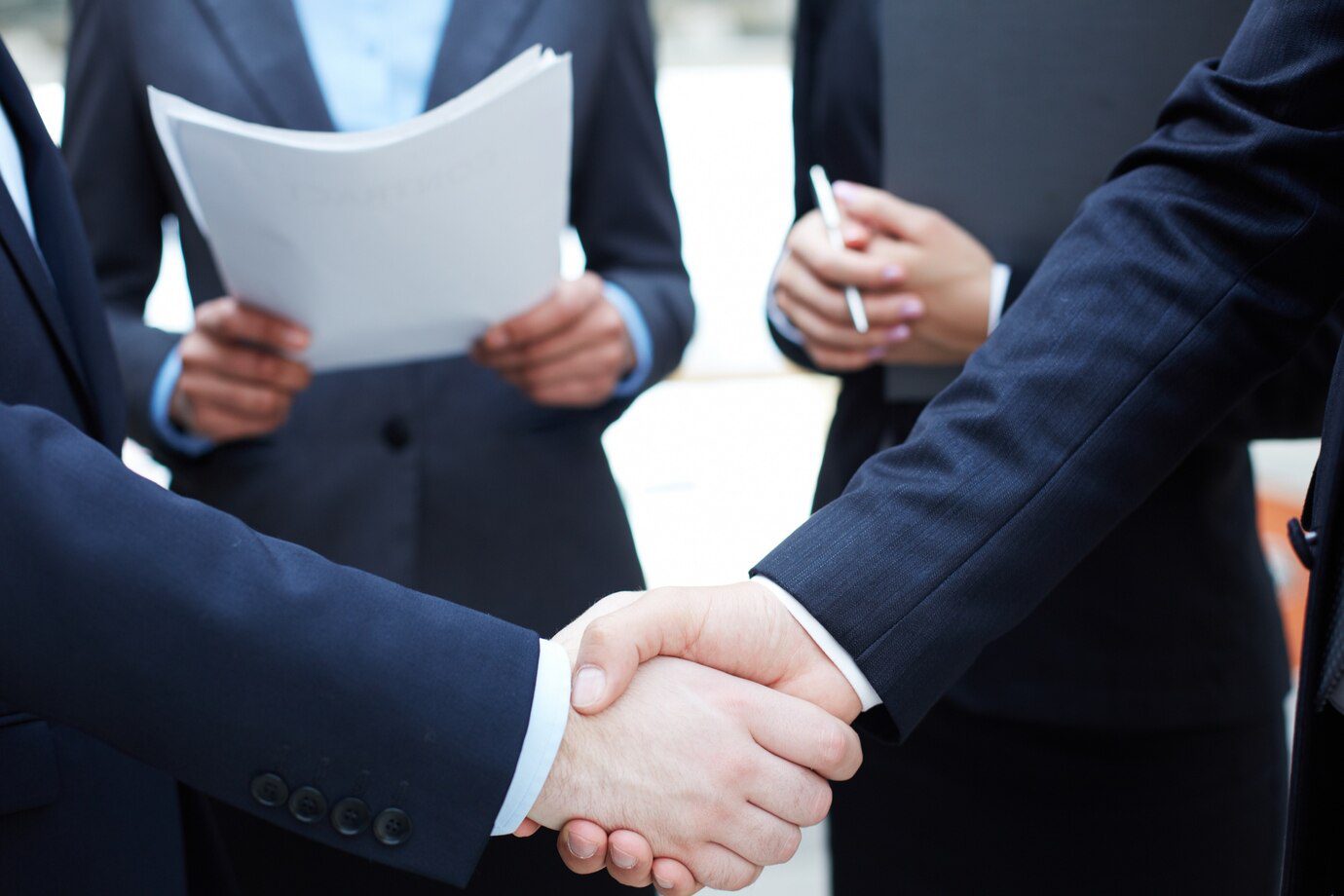 Handshake between two immigration attorneys